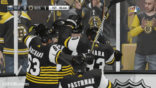 A Hockey Game Is Being Played Between The Bruins And Bos GIF