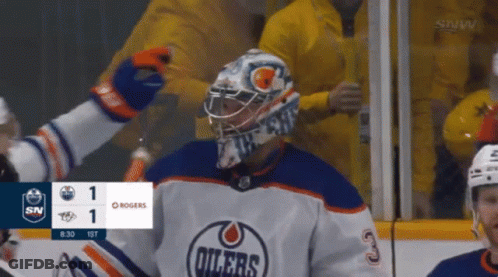A Hockey Game Is Being Played Between The Oilers And Rogers GIF