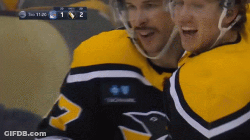 A Hockey Game Is Being Played Between The Penguins And The Rangers GIF