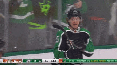 A Hockey Game Is Being Played Between The Stars And The Hawks GIF
