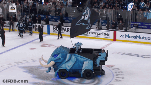 A Hockey Game Is Being Played In A Stadium Sponsored By Massmutual Enterprise And Delta GIF