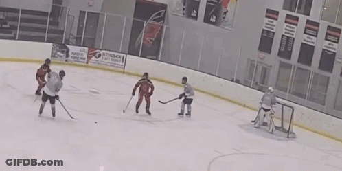 A Hockey Game Is Being Played In A Stadium With A Coca Cola Ad On The Walls GIF