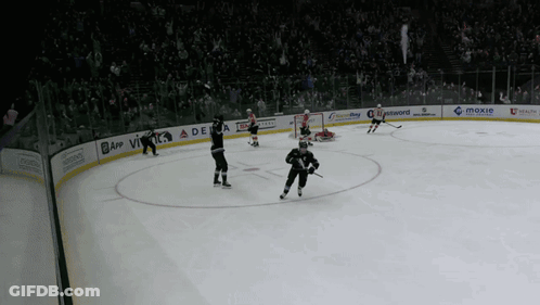 A Hockey Game Is Being Played In A Stadium With A Delta Advertisement On The Ice GIF