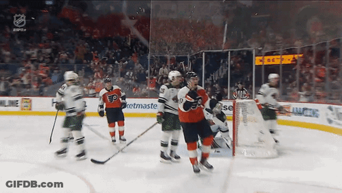 A Hockey Game Is Being Played In A Stadium With A Netmaster Ad In The Background GIF