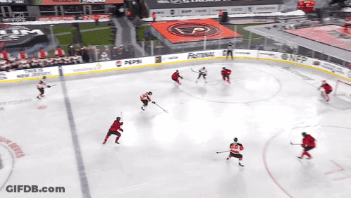 A Hockey Game Is Being Played In A Stadium With A Pepsi Ad GIF