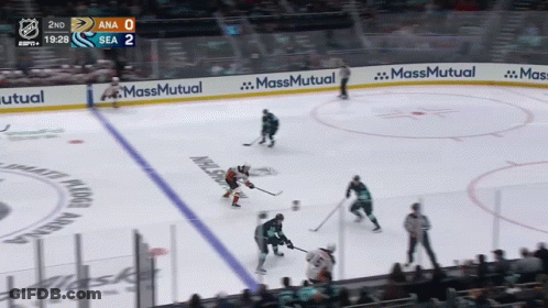 A Hockey Game Is Being Played In A Stadium With Ads For Massmutual On The Ice GIF