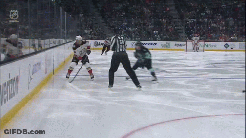 A Hockey Game Is Being Played In A Stadium With Advertisements For Amazon And Boeing GIF