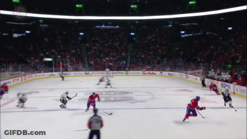 A Hockey Game Is Being Played In A Stadium With Advertisements For Tim Hortons And Budweiser GIF