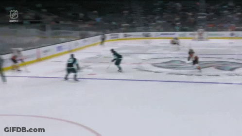 A Hockey Game Is Being Played In A Stadium With The Nhl Logo Visible GIF