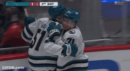 A Hockey Game Is Being Played In California And The Players Are Hugging Each Other GIF