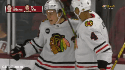 A Hockey Game Is Being Played In Chicago And The Players Are Kevin Korchinski And Seth Jones GIF