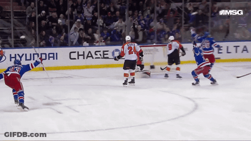 A Hockey Game Is Being Played In Front Of A Banner For Hyundai Chase GIF