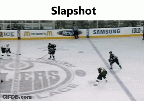 A Hockey Game Is Being Played In Front Of A Banner That Says Samsung GIF