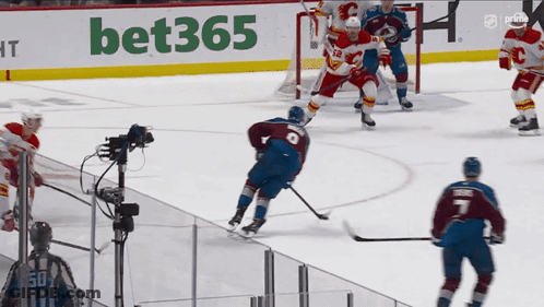 A Hockey Game Is Being Played In Front Of A Bet365 Sign GIF