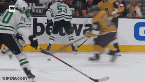 A Hockey Game Is Being Played In Front Of A Betwa Advertisement GIF