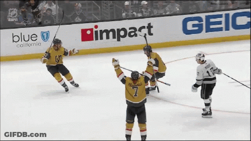 A Hockey Game Is Being Played In Front Of A Blue California Advertisement GIF