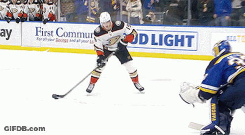 A Hockey Game Is Being Played In Front Of A Bud Light Advertisement GIF