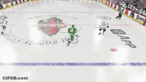 A Hockey Game Is Being Played In Front Of A Crowd And A Banner That Says Nflshop.com GIF