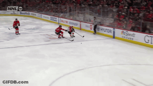 A Hockey Game Is Being Played In Front Of A Crowd With Nhl On The Screen GIF