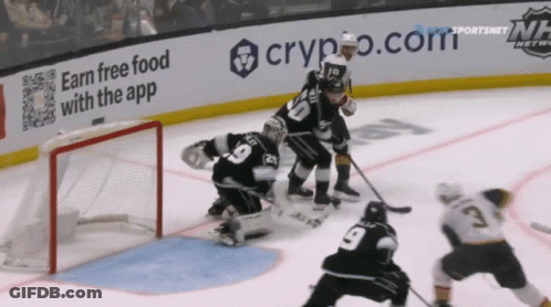 A Hockey Game Is Being Played In Front Of A Crypto.com Ad GIF