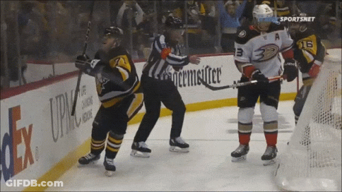 A Hockey Game Is Being Played In Front Of A Fedex Sign GIF