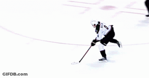 A Hockey Game Is Being Played In Front Of A Ford Ad GIF