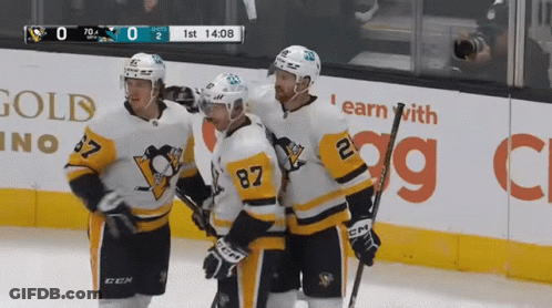 A Hockey Game Is Being Played In Front Of A Gold Casino Sign GIF