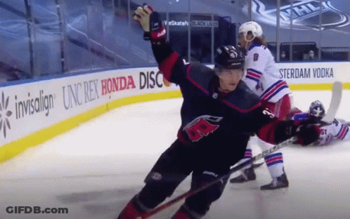 A Hockey Game Is Being Played In Front Of A Honda Ad GIF