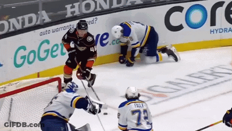A Hockey Game Is Being Played In Front Of A Honda Advertisement GIF