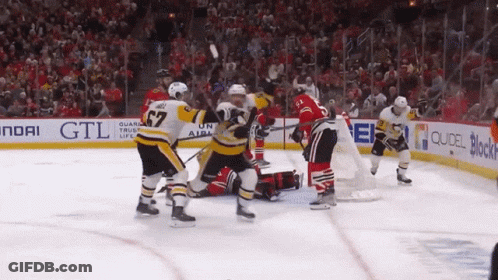 A Hockey Game Is Being Played In Front Of A Hyundai Sign GIF