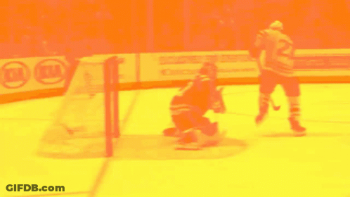 A Hockey Game Is Being Played In Front Of A Kia Ad GIF