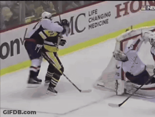 A Hockey Game Is Being Played In Front Of A Life Changing Medicine Sign GIF