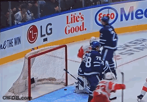 A Hockey Game Is Being Played In Front Of A Life 'S Good Banner GIF