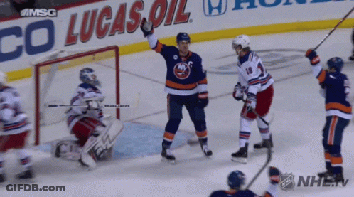 A Hockey Game Is Being Played In Front Of A Lucas Oil Sign GIF