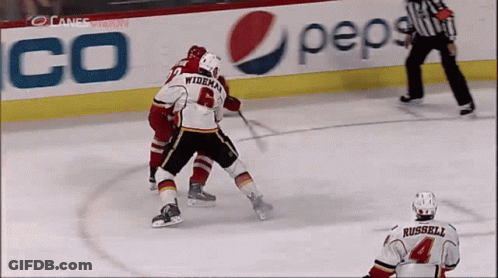 A Hockey Game Is Being Played In Front Of A Pepsi Advertisement GIF
