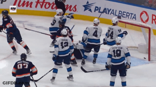 A Hockey Game Is Being Played In Front Of A Playalberta Advertisement GIF