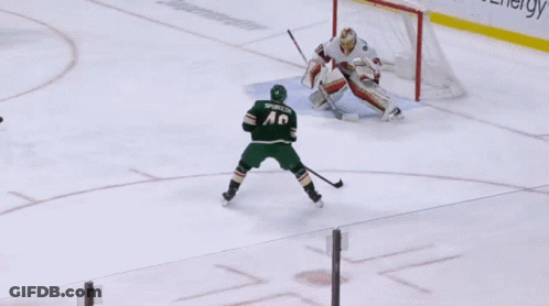 A Hockey Game Is Being Played In Front Of A Polaris Advertisement GIF