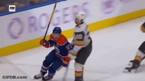 A Hockey Game Is Being Played In Front Of A Rogers Banner GIF