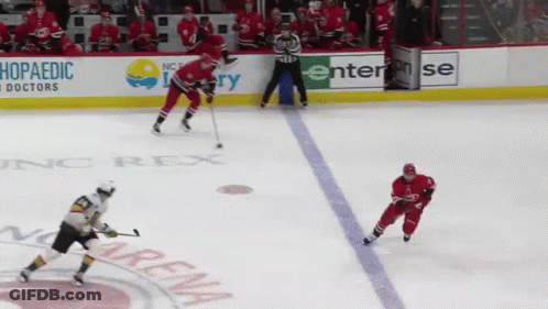 A Hockey Game Is Being Played In Front Of A Sign That Says Enterprise GIF