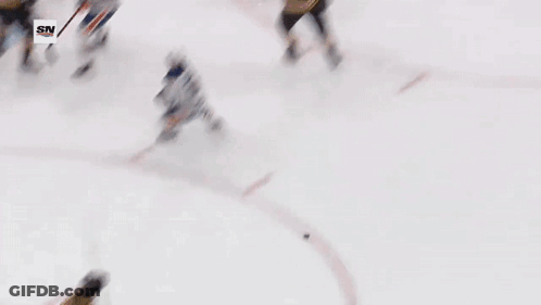 A Hockey Game Is Being Played In Front Of A Sn Banner GIF