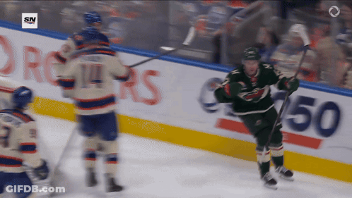 A Hockey Game Is Being Played In Front Of A Sn Logo GIF