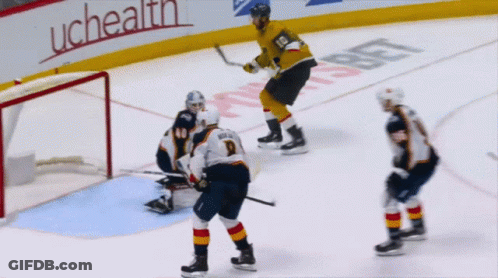 A Hockey Game Is Being Played In Front Of A Uchealth Banner GIF