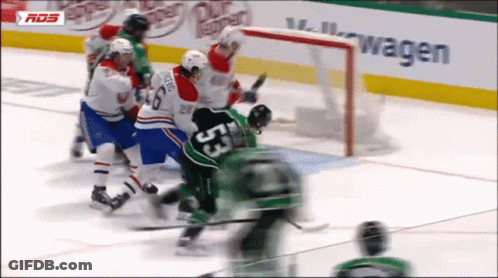 A Hockey Game Is Being Played In Front Of A Volkswagen Sign GIF