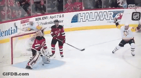 A Hockey Game Is Being Played In Front Of A Wall That Says Halmar GIF