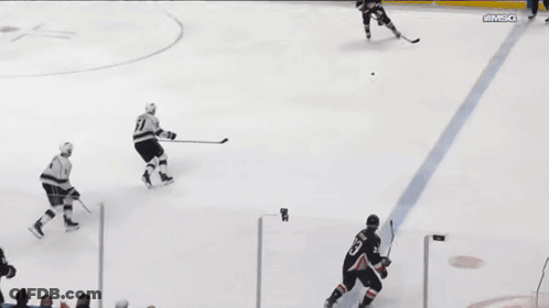 A Hockey Game Is Being Played In Front Of An Austin Air Sign GIF