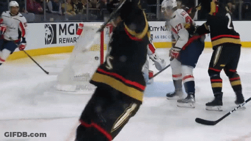 A Hockey Game Is Being Played In Front Of An Mgm Rewar Sign GIF