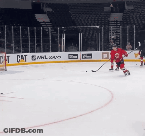 A Hockey Game Is Being Played In Front Of An Nhl.com/cs Banner GIF