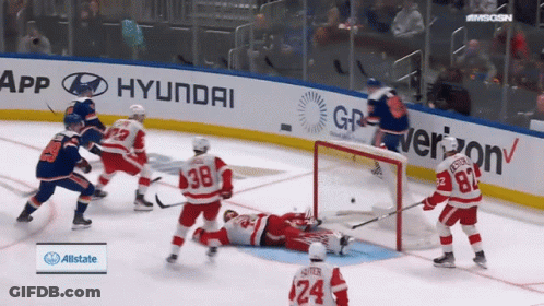 A Hockey Game Is Being Played In Front Of Hyundai And Verizon Advertisements GIF