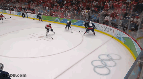 A Hockey Game Is Being Played In Vancouver In 2010 GIF