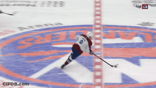 A Hockey Game Is Being Played On A Ice Rink And A Player With The Number 8 On Their Jersey GIF